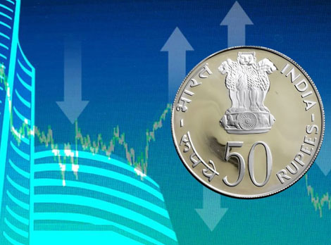Stock market chart with Indian rupee coin