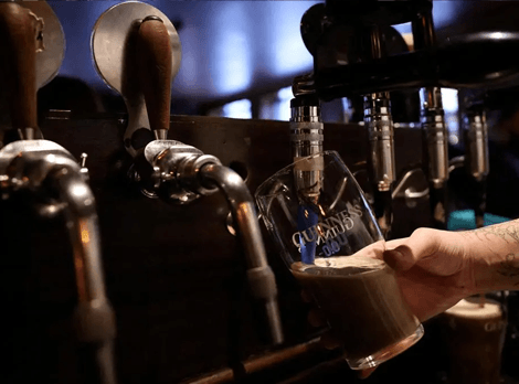 Beer being poured from a bar tap